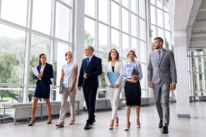 team of entrepreneurs walking in corporate office building